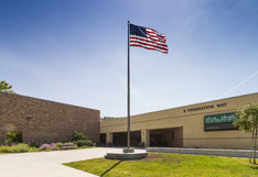front of school with flag